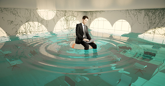 Businessman in flooded office