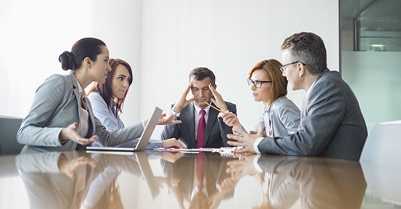 Businesspeople arguing in meeting