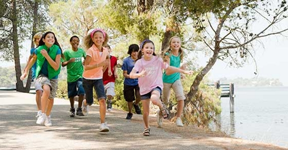 Group of kids running in park