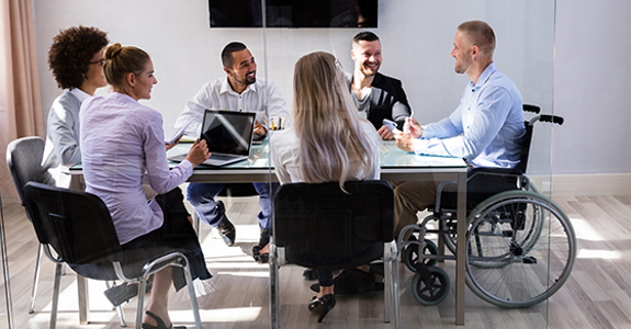 Colleagues sitting at a meeting table