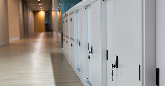 Hallway with file cabinets along one wall