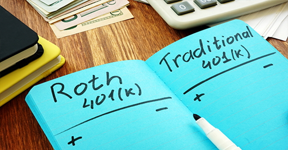 Handwritten notes in notebook comparing Roth 401(k) and traditional 401(k)