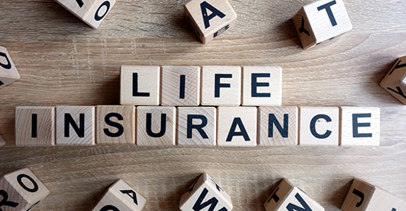 Wooden blocks spelling the phrase "LIFE INSURANCE"